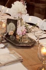 Table set for an event party. Whimsy Vintage Wedding Reception Vintage Wedding Centerpieces Vintage Centerpieces