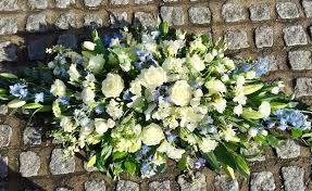 Maybe you would like to learn more about one of these? White And Blue Casket Spray Welwyn Florist