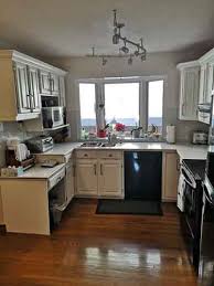 Refinishing the wooden cabinets in your kitchen can give it a fresh new look. Refinishing Kitchen Cabinets Kitchen Cabinets Refinishing How To Refinish Kitchen Cabinets New Look Cabinets
