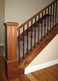 Wood is often used to construct the banisters in homes because it you can switch this up, however, by replacing the wood banisters with the wrought iron variety. Wood Railing With Wrought Iron Balusters Traditional Staircase Salt Lake City By Titan Stairs Utah Houzz Ie