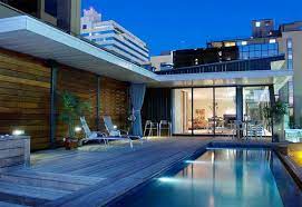 Discover pool deck ideas and landscaping options to create your poolside dream. 15 Stunning And Relaxing Rooftop Pools Home Design Lover