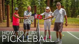 The dimensions and layout of a badminton court, and a net. How To Play Pickleball Youtube