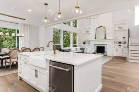 Check spelling or type a new query. Beautiful White Kitchen And Living Room In New Luxury Home With Hardwood Floors And Stainless Steel Appliances Stock Photo Picture And Royalty Free Image Image 138766682