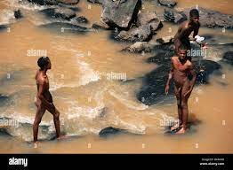 Naked boys having a bath on the river, Oromia Region, Southern Ethiopia  Stock Photo - Alamy