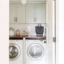 The first thing to consider when designing your laundry center is the amount of floor space you have holly c bertsch says: Countertop Over Washer Dryer Design Ideas