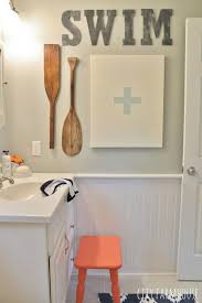 A rustic outdoor bathroom with a metal bathtub and some smaller tubs for storage. Preppy Coastal Bathroom Reveal City Farmhouse Pool House Decor Pool House Bathroom Pool Bathroom Ideas