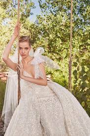 Acutely aware of what brides are looking for, the designer drew inspiration from her travels to create something different, something more couture. Elie Saab Fall 2021 Wedding Dresses Arabia Weddings