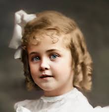 This beautifully composed portrait was taken by W. J. Ramsey in  Gainesville, Georgia. The young girl sits with folded hands, her hair  neatly braided, her printed dress crisp with a wide white
