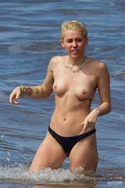 Miley Cyrus nude on stage and at the beach 16 photos