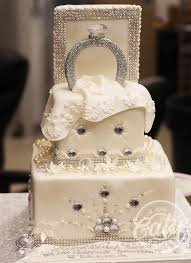 Two tier red velvet cake covered in fondant and decorated with hand cut fondant accents. Engagement Ceremony Engagement Cakes 2019