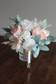 A beautiful mix of white/ivory flowers mixed with green and grey foliage. Lambs Ear Bridal Bouquet Dusty Miller Bridal Silk Flower Bouquet Blush Roses Boho Wedding Bouquet Artificial Winter Or Spring Bouquet Accessories Weddings Valresa Com