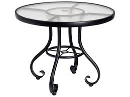 These types of tables also pair well with outdoor bars. Woodard Ramsgate Aluminum 48 Wide Round Glass Top Dining Table With Umbrella Hole Iron Glass Top Table Glass Top Dining Table 48 Round Dining Table