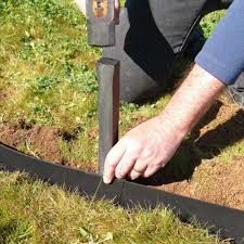 Pack soil down so that the edging is covered 1/3 of the way. Garden Edging Kit With Pegs Recycled Plastic Greenmongrel By Plastic Forests