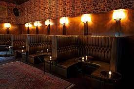 Brown Leather High Back Booths Line One Wall Opposite The Bar In The Main Room Hookah Lounge Decor Bar Booth Back Bar Design
