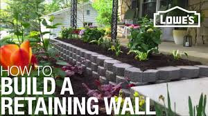 Pavestone rumbled wall in granite blend. How To Build A Retaining Wall Youtube