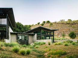 I need a butterfly roof that starts like a sine curve at the eave and flattens out to the valley. Butterfly House Feldman Architecture Archdaily