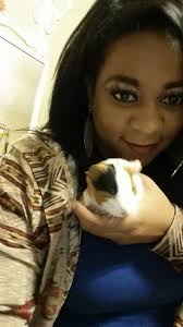 She's growing and the black is spreading, her tail is curly black .. little  pig tail .. Roxie