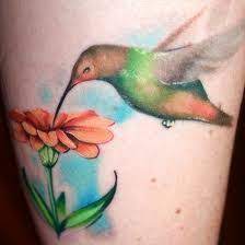 Hummingbird Tattoos Meanings Designs History And Photos Hummingbird Tattoo Flower Wrist Tattoos Flower Thigh Tattoos