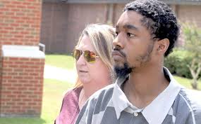 Murder suspect charged