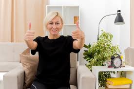 Maybe you would like to learn more about one of these? Free Photo Smiling Beautiful Blonde Russian Woman Sits On Armchair Thumbs Up With Two Hands