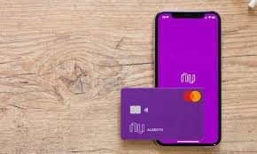 Nubank logo on the screen of the mobile device. Nubank To Launch Credit Card In Mexico Pymnts Com
