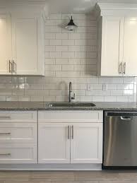 White Kitchen Cabinets With This White Subway Tile And Gooseneck Black Light Fixture Are A Great Comb White Shaker Kitchen Kitchen Remodel Small Kitchen Design