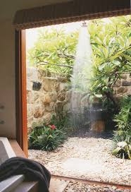 A bewitching and serene outdoor shower with vegetation surrounding it for privacy. Beach House Life Style A Private Outdoor Shower With A Beautiful