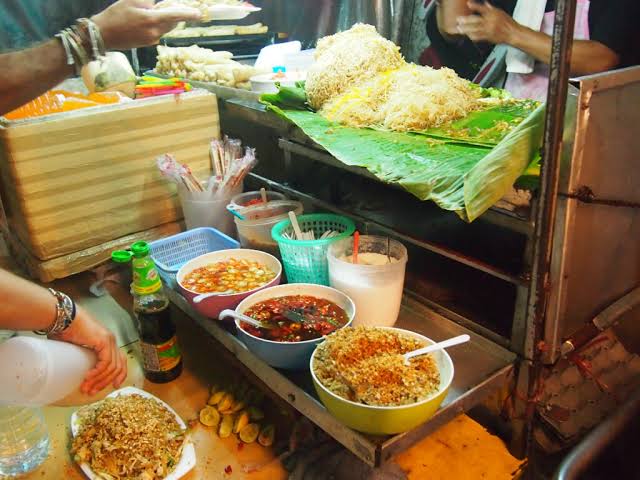 Bangkok night markets: High heat, bold flavors, and non-stop energy., AI generated