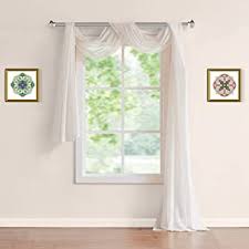 Someone has not only draped a scarf valance over a pair of panels in a very innovative way but if you notice they have also puddled the panels on the floor. Amazon Com Window Scarf