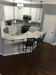 white kitchen with dark floors. love my