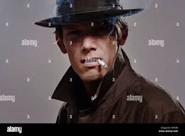 Trench coat detective hi-res stock photography and images