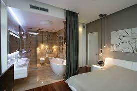 Another take on something that is open but puts the sink cabinets and vanities directly between the master bath and master bedroom with the mirror hanging down. 25 Sensuous Open Bathroom Concept For Master Bedrooms Ensuite Bathroom Designs Open Concept Bathroom Open Plan Bathrooms