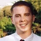 A South Vietnamese woman crying over a plastic bag containing the remains  of her husband, he was found in a mass grave of non-combatants murdered by  Communist forces during the Tet Offensive.