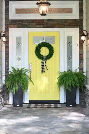 Christmas decorated porch with little trees and lanterns. How To Paint A Front Door Tips Steps The Design Twins
