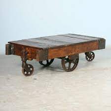 A great coffee table should be a stylish and functional gathering point for your home. Antique Vintage Luggage Cart Coffee Table Circa 1920 With Cast Iron Wheels At 1stdibs