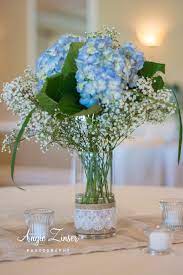 Sweet Hydrangea And Baby S Breath Centerpiece Hydrangea Centerpiece Wedding Hydrangeas Wedding Hydrangea Arrangements