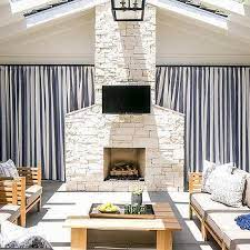 When using natural stone tile , if you are looking for consistency in color and veining, the blogger suggests picking out tiles in person instead of ordering online. Cream Stone Outdoor Fireplace Design Ideas