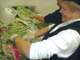 Aggie Tinsley Of Mckay S Fine Food And Pharmacy Stuffs One Of A Planned 400 Stuffed Hams To Be Available In Mckay S Food Ham Corned Ham Recipe Maryland Recipe