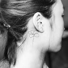 Plumeria flower donates new beginning and new life. Continuous Line Plumeria Flower Tattoo Behind The Right