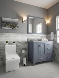 As you can see, combining soft blue color with gray and white tiles all over the bathroom would offer a soothing coastal look. Gray And Blue Bathroom With Wainscoting Wainscoting Bathroom Bathroom Design Small Blue Bathroom