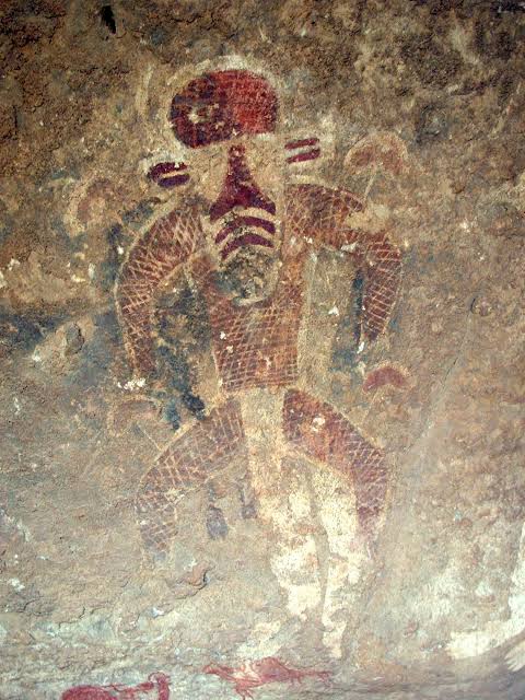 Prehistoric rock art in Tassili n'Ajjer, Algeria, often interpreted as early evidence of human mushroom interaction., AI generated