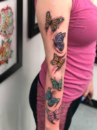 Check out these butterfly tattoos for an insightful view of their symbolism and graphic a cool idea for hand tattoos, this one divides a butterfly in half. Butterfly Arm Tattoo Colorful Butterfly Sleeve Tattoo Butterfly Tattoos For Women Butterfly Tattoos On Arm