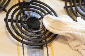 Under the burners looks pretty bad & it is time for a good cleaning. How To Clean Electric Stove Burners Apartment Therapy