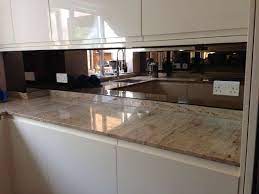The kitchen is small and has no windows and the mirror really opened it up and made it look bright. Cornelscourt Glass Ltd Glass Mirror Pvc Window Specialists Mirror Backsplash Kitchen Beadboard Backsplash Trendy Kitchen Backsplash