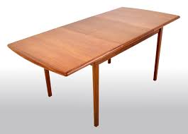 This modern beauty is available in a number of hardwoods and six expanding top sizes. Mid Century Modern Danish Style Teak Butterfly Leaf Dining Table 1960s At 1stdibs