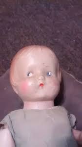 She has an interesting face and costume. Alas. her hair is dissolving.. her  face has almost a compressed chip board feel.. No markings., Please pardon  me if I have posted her before |