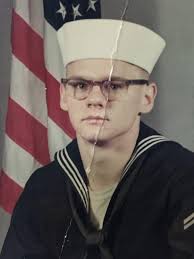 Can you restore and colorize the image of the Petty Officer in the back