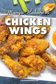 These Sweet And Spicy Chicken Wings Are Tossed With A Homemade Mango Habanero Sauce That You Can Whip Spicy Recipes Wing Sauce Recipes Sweet And Spicy Chicken
