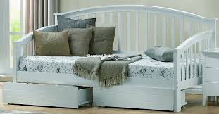 The engineered wood design features a storage trundle as well as three drawers for bedding, clothing, and more. White Wood Day Bed With Drawers Sleepland Beds
