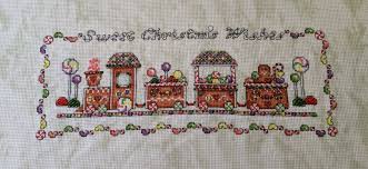 Tiny gingerbread guy designed by: Gingerbread Train The Xstitching Runner